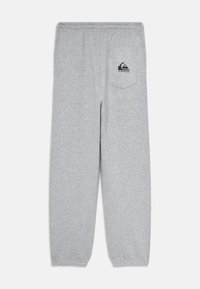 Svijetlosive dukserice s elastičnim pojasom i manžetama, s jednim stražnjim džepom na kojem se nalazi crni Quiksilver logo.