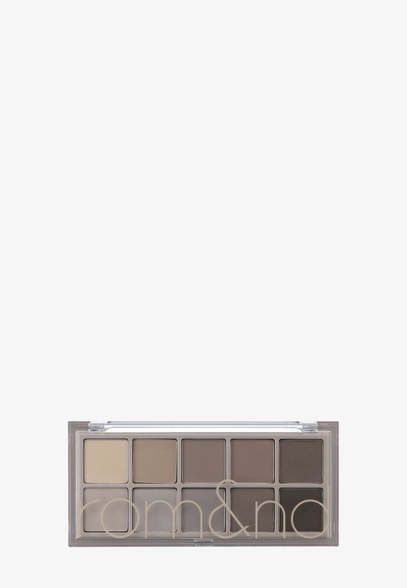 Paleta cieni do powiek z 10 matowymi odcieniami w neutralnych tonach, umieszczona w prostokątnej przezroczystej obudowie, która zawiera mały aplikator.
