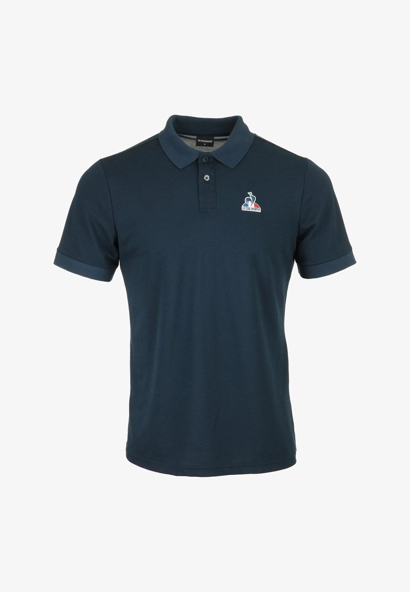 Polo shirt marine en coton, avec un col classique, des manches courtes et un logo brodé sur la poitrine. Texture lisse.
