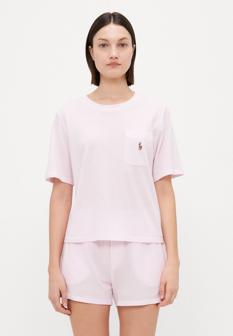 Light pink cotton sleep set featuring a short-sleeve t-shirt with a chest pocket and matching shorts, both with a relaxed fit.