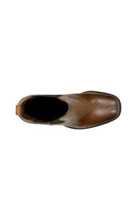 Hnědá kožená Chelsea bota z pohledu shora, zobrazující čtveratou špičku, elastické boční panely a poutko na patě.