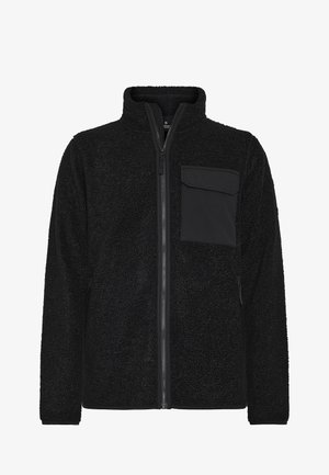 Schwarze Fleecejacke aus strukturiertem Stoff, mit hohem Kragen, durchgehendem Reißverschluss und einer Brusttasche auf der linken Seite. Schlichtes, unauffälliges Design. Weiche Haptik.