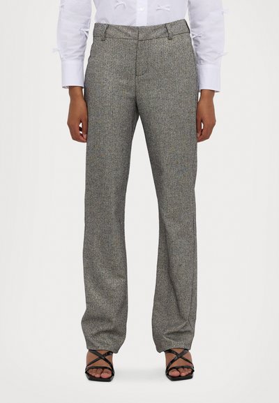 Gray patterned trousers with a straight leg design, featuring a subtle texture and a flat front. Paired with black strappy shoes.
