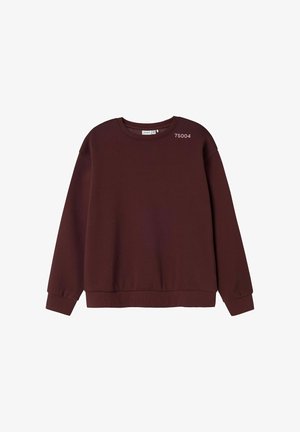 Bordo džemperis su apvaliu iškirpimu, raukinėtomis rankovėmis ir apačia. Priekyje yra mažas baltas tekstas. Minkšta, tekstūruota medžiaga.