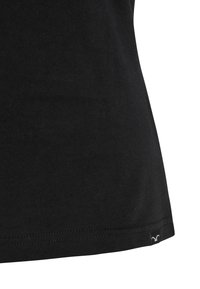 Black cotton T-shirt featuring a smooth texture, fitted shape, and a small logo tag at the lower hem. Seam detailing is visible.