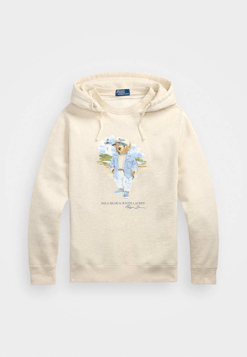 Beige hettegenser laget av en bomullsblanding, med et grafisk motiv av en bjørn i uformelle klær. Den har hette med snor og ribbestrikkede mansjetter.