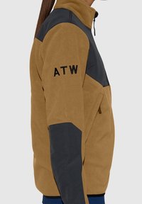 Brown fleece jacket with dark gray accents, high collar, side zip pocket, and "ATW" embroidered on the left arm. Soft texture.