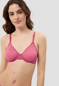 Rosa nahtloser BH mit verstellbaren Trägern, vorgeformten Cups und einer glatten Textur. Verfügt über eine dreieckige Form und dezente Nähte.