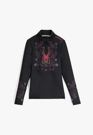 Maglietta nera a maniche lunghe con collo a metà zip, caratterizzata da una vivace grafica di ragno e motivi floreali con accenti rossi, viola e verdi.