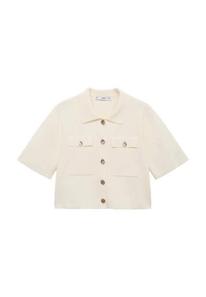 Chemise crème coupée avec col, manches courtes, fermeture à huit boutons sur le devant, deux poches poitrine et accents de boutons métalliques.