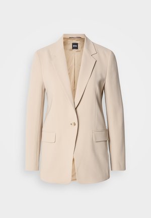 Beige blazer made of smooth fabric, featuring a single button closure, two front pockets, and a notched lapel design. Interior is tan.