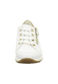 White sneaker with a smooth leather upper, six lace eyelets, gold-tone hardware, side zipper detail, and a light brown rubber sole.