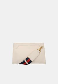 Beige leather handbag with a structured shape, featuring a decorative shoulder strap in navy blue and red. Gold hardware accents present.