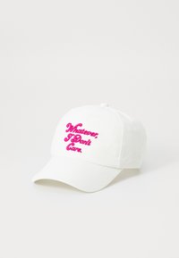White cotton baseball cap with a curved brim. Features pink embroidered text reading "Whatever. I Don't Care." on the front.