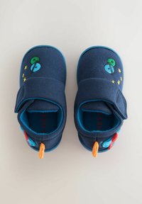 Navy fabric baby shoes with a hook-and-loop closure, featuring colorful planet and star embroidery, and textured accents on the heel.