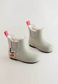 Szürke gumicsizmák puha fehér béléssel, rugalmas oldalpanellel, rózsaszín húzófülekkel és egy mesealakú díszítéssel az oldalukon.