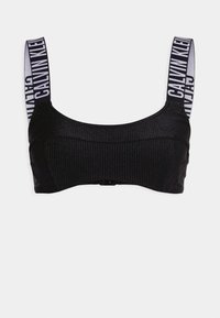 Črna rebrasta bralette s širokimi naramnicami z belim «CALVIN KLEIN» blagovno znamko. Preprost dizajn, mehka tekstura in zaponka na hrbtu.