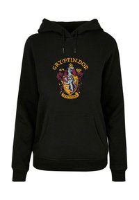 Felpa nera in cotone, con il crest di Grifondoro in rosso, oro e bianco. Include una tasca frontale e cappuccio con cordini.