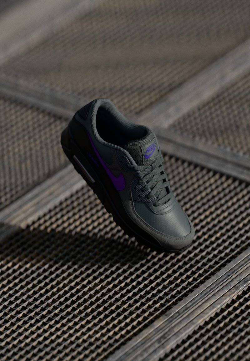 Nike Air Max shoes, featuring a dark green leather upper with purple accents, lace closure, padded collar, and textured rubber sole.