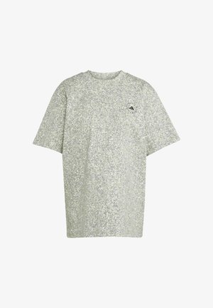 T-shirt texturé vert clair avec un motif moucheté. Présente un col rond et des manches courtes. Petit logo sur la zone du côté gauche de la poitrine.