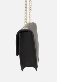 Black synthetic leather handbag with a textured finish, gold chain strap, rectangular shape, and metal accents.