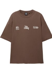 Brown oversized t-shirt made of cotton. Features graphic prints in white, including "Modern Archaeology" and logos on the front.