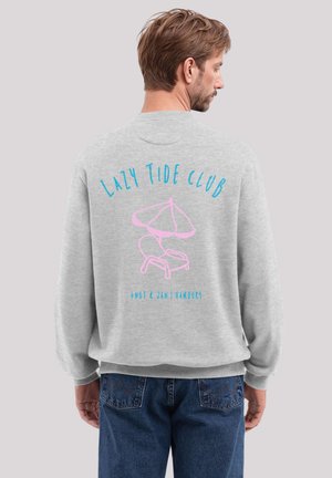 Gray sweatshirt with a relaxed fit, featuring a pink beach chair illustration and "LAZY TIDE CLUB" in blue text on the back.