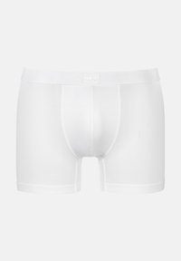 Boxer-briefs blancs en tissu texturé avec un design ajusté. Dotés d'une ceinture douce avec logo et d'une poche avant structurée.