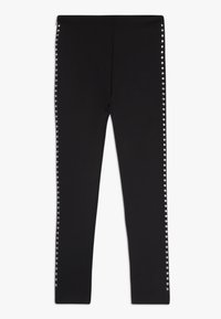 Zwarte legging met een gladde textuur en een slim fit, voorzien van zilveren studs langs de buitenzijde voor decoratieve details.