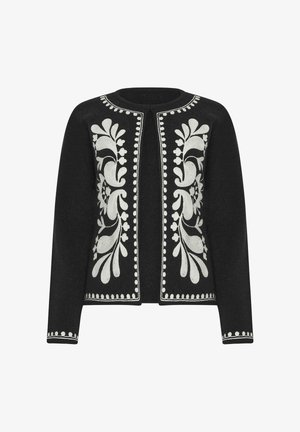 Black long-sleeve open-front cardigan with white floral embroidery down the front and dot trim on collar, cuffs, and hem.