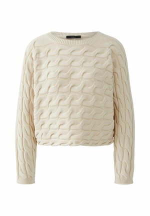 Beige gebreide trui met een gewaveerd structuurpatroon, ronde halslijn en lange mouwen. De stof lijkt zacht en iets rekbaar.