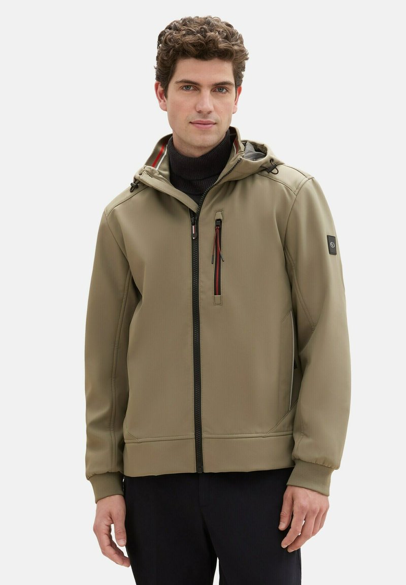 Olive green windbreaker jacket with a hood, zippered front, and side pockets. Features red accents and elastic cuffs for a snug fit.