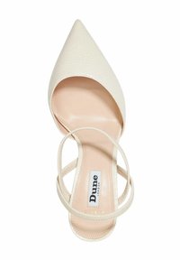 Pointed-toe heeled sandal in textured cream material. Features thin crisscross straps and a smooth nude insole with branding detail.