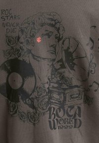 Dark gray graphic t-shirt featuring a design of a male figure with roses, vinyl records, and musical notes. The text reads "ROC STARS NEVER DIE."