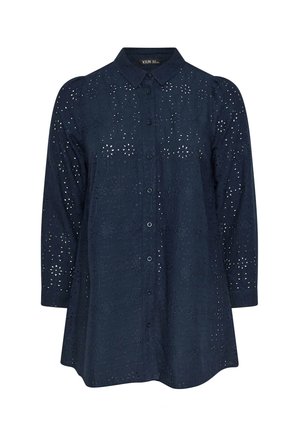 Camisa de color azul marino con mangas largas, cierre delantero con botones, patrón de ojal floral, dobladillo redondeado y detalles en el collar. Tejido suave con diseño texturizado.