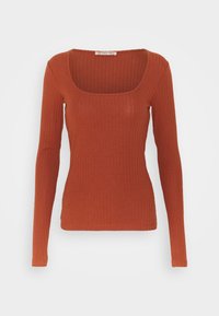 Dlouhý rukáv, přiléhavý top z rezavě zbarvené žebrované látky. Má čtvercový výstřih a hladkou texturu. Minimalistický design bez vzorů či ozdob.