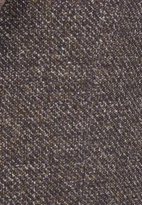 Close-up of brown and gray herringbone patterned fabric with visible textured weave and diagonal lines.