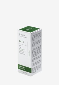 Scatola verde e bianca per il siero facciale Odacité Buriti Lime, 5 ml. Presenta un testo sui benefici per la pelle flaccida, con una finitura testurizzata sui lati.