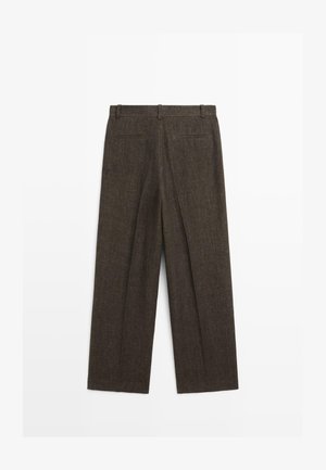 Mørkebrune uldblandingsbukser med bæltestropper, to baglommer med kant og en lige ben-snit.