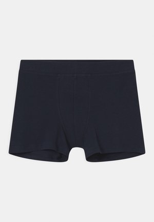 Mörkblå bomullsboxershorts med elastisk midja, med paneldesign och sömnadsdetaljer. Slät textur, längd till mitten av låret.