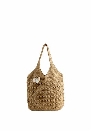 Woven straw tote bag with a shoulder strap, decorated with three hanging seashell charms.