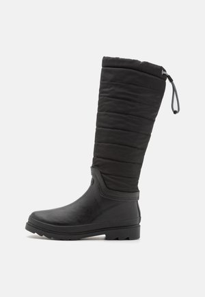Botte d'hiver noire haute avec tige supérieure matelassée, partie inférieure en caoutchouc, semelle épaisse et cordon ajustable en haut pour un ajustement parfait.