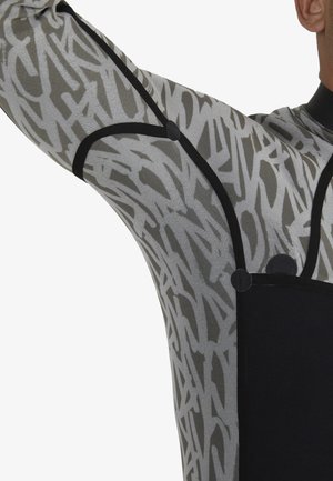 Long-sleeve garment featuring a black and gray abstract pattern, with contrasting black accents and circular hardware details.