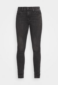 Jeans skinny negros de denim con una textura suave. Cuenta con cinco bolsillos, pasadores para cinturón y un cierre de botón. Desgaste sutil en las piernas.