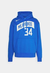 Modrá mikina Nike s kapucí, se přední kapsou, na které je napsáno "MILWAUKEE" a číslo "34" v bílé barvě, nastavitelná kapuce se šňůrkami a pružné manžety.