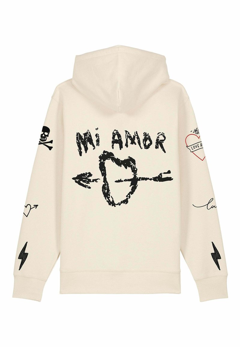 Felpa beige con stampa grafica nera, inclusa la scritta "Mi Amor", un cuore con una freccia e vari disegni come un teschio e fulmini.