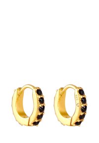 Orecchini a cerchio in oro con accenti di gemme nere, finitura lucida e design senza soluzione di continuità; realizzati in argento sterling.