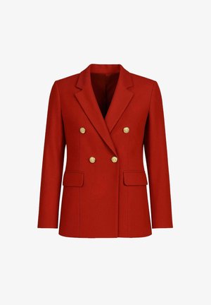 Blazer orange brûlé à double boutonnage avec des boutons dorés, revers, manches longues et poches plaquées à l'avant, présenté sur un fond blanc.