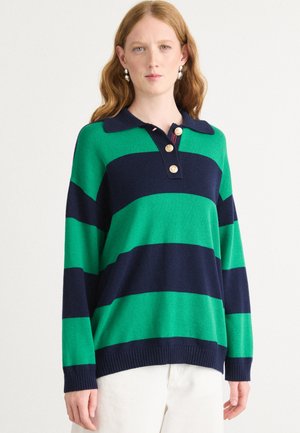Green and navy striped knit polo sweater with a collar and three gold buttons at the neckline. Relaxed fit and ribbed hem.