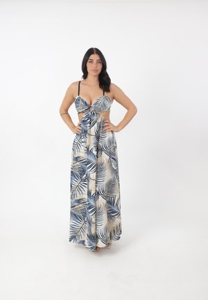Abito maxi in beige con motivo di foglie di palma blu, caratterizzato da un design con aperture, spalline regolabili e una silhouette fluida.
